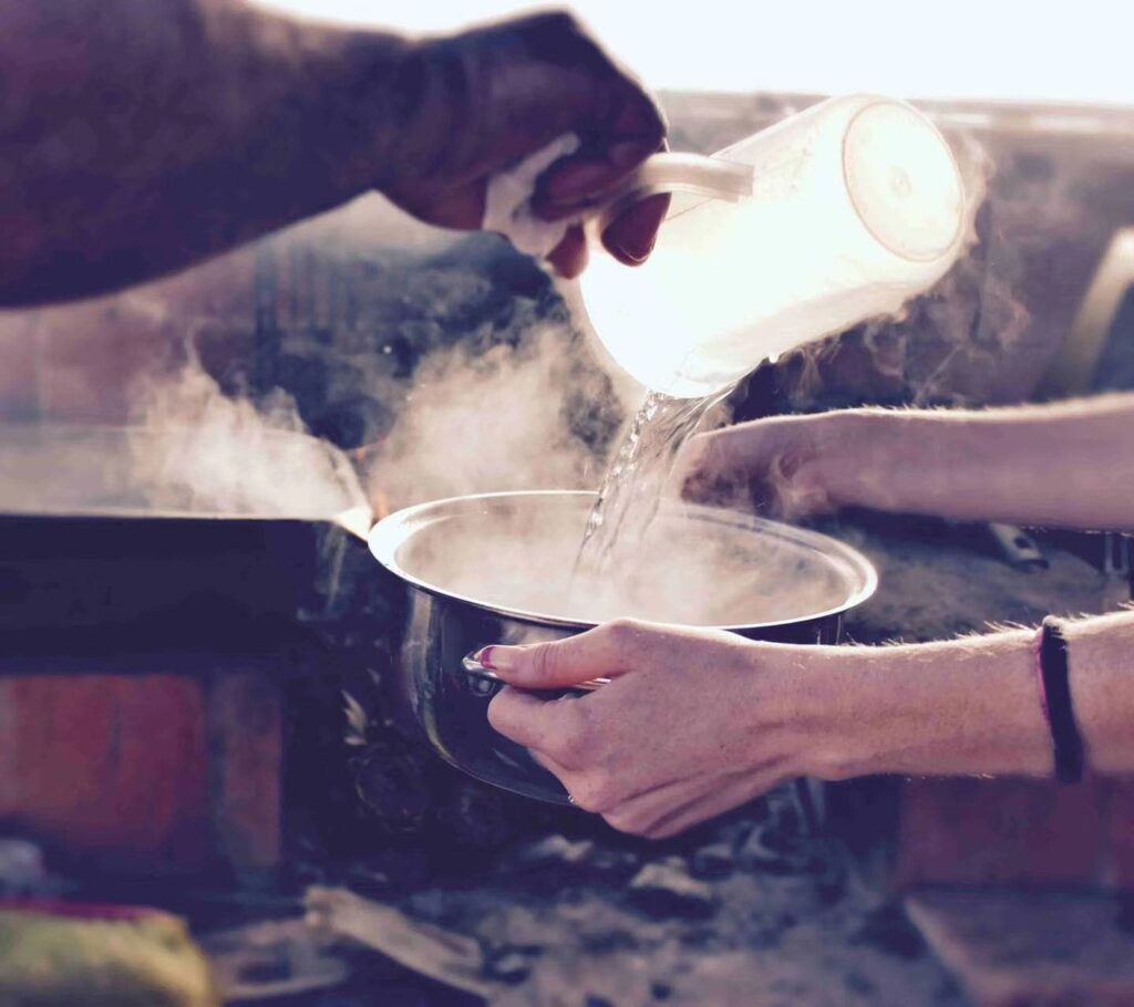 pour the hot water into the pot