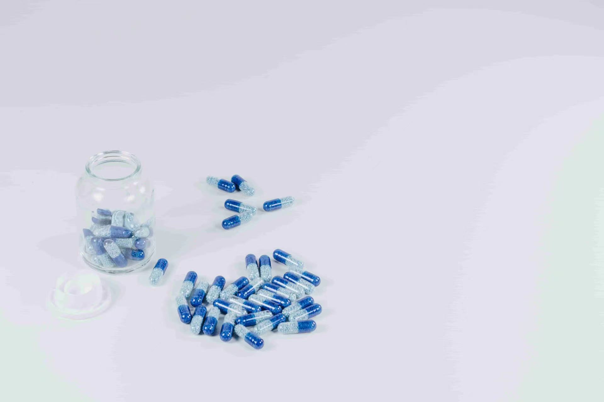 clear glass pill bottles and medicine pills