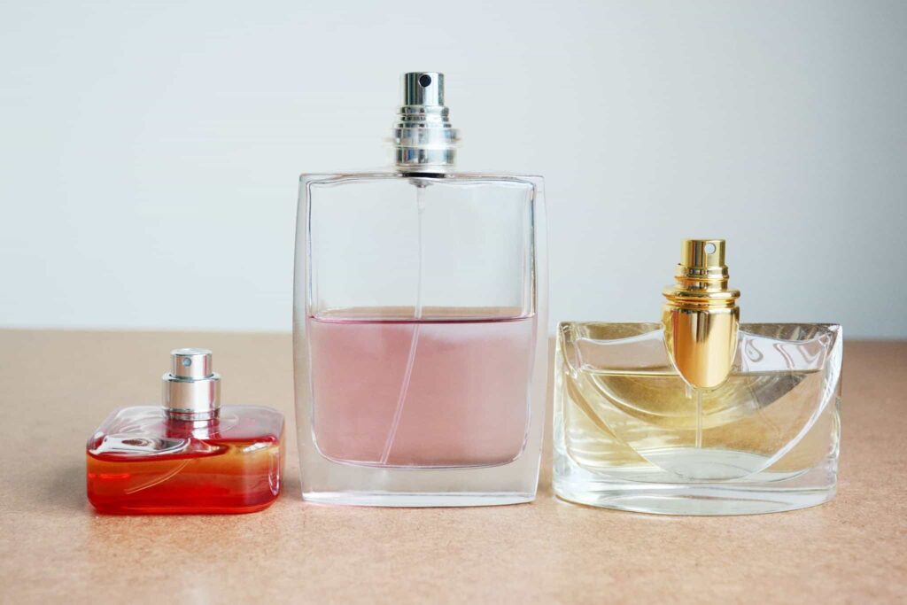 perfume in different sizes of glass bottles