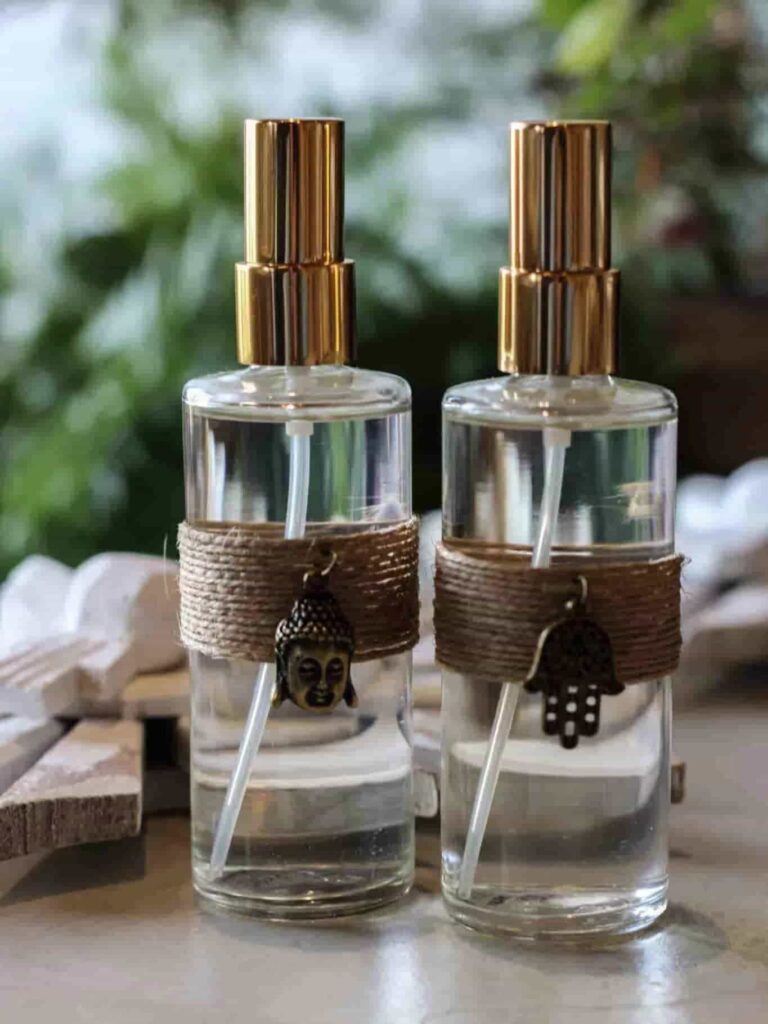 two cylinder clear glass perfume bottles