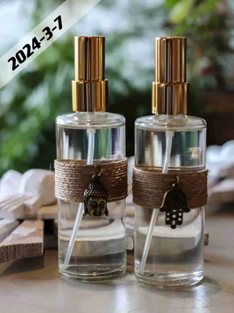 two cylinder clear glass perfume bottles