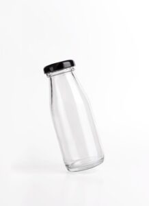 MoÑkup transparent empty glass bottle product on white background.