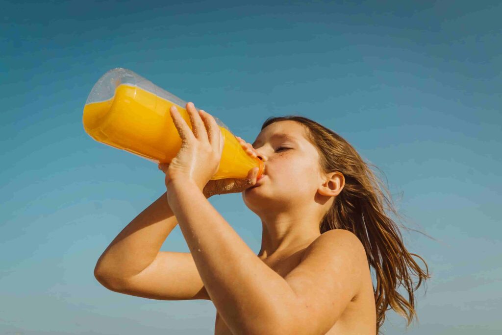 a girl drinking the juice