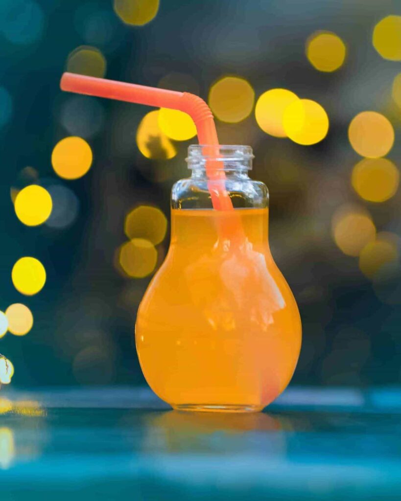 orange juice in the glass bottle of bulb shape