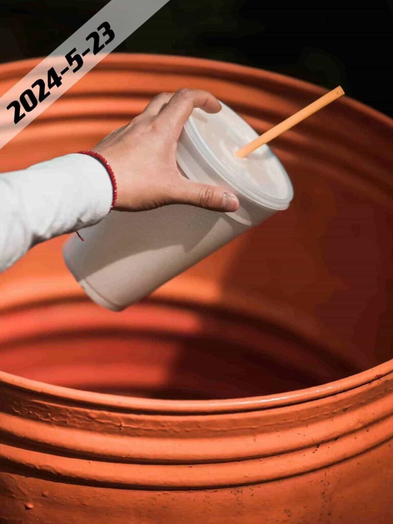 drop a cup in trash bin
