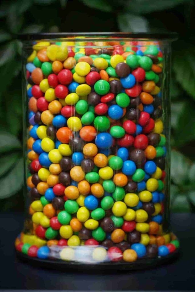 colorful candies in a big glass jar