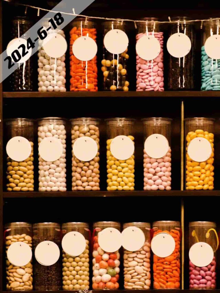 candies in glass jars on the shelf