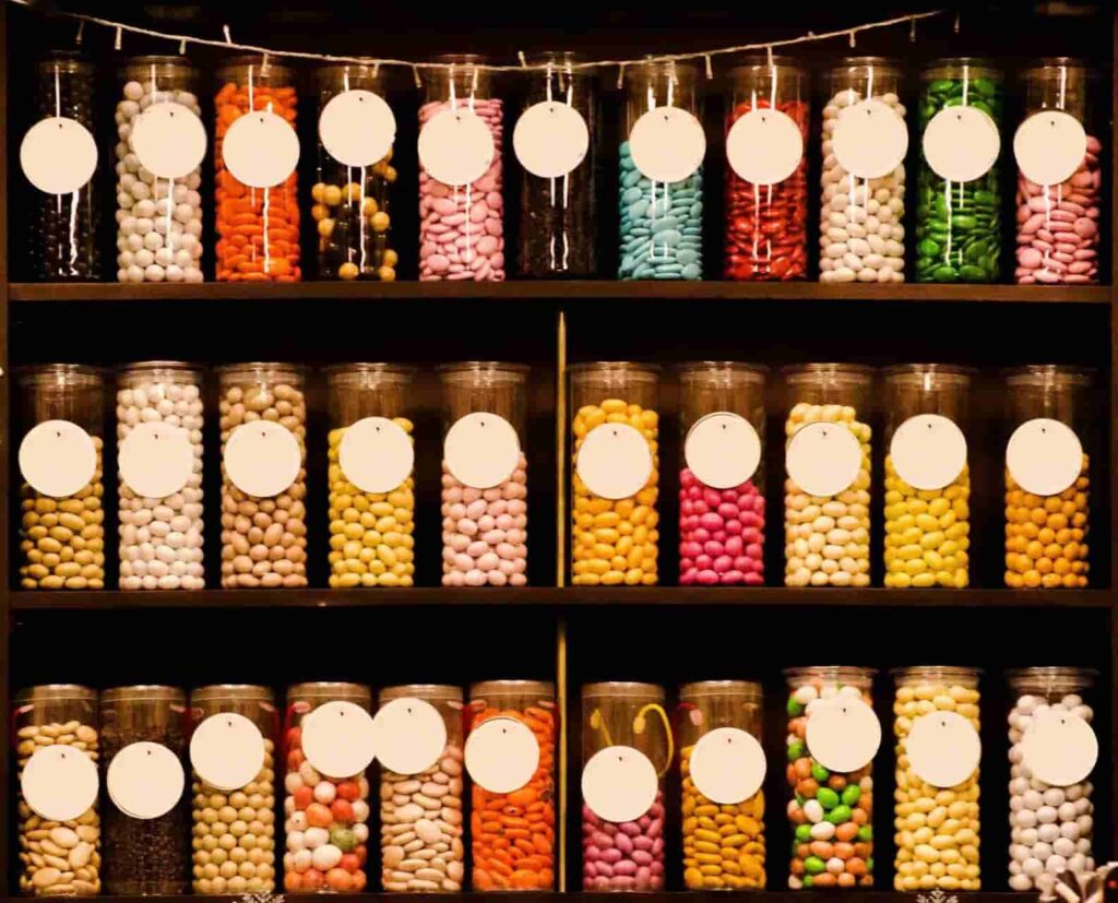 candies in glass jars on the shelf
